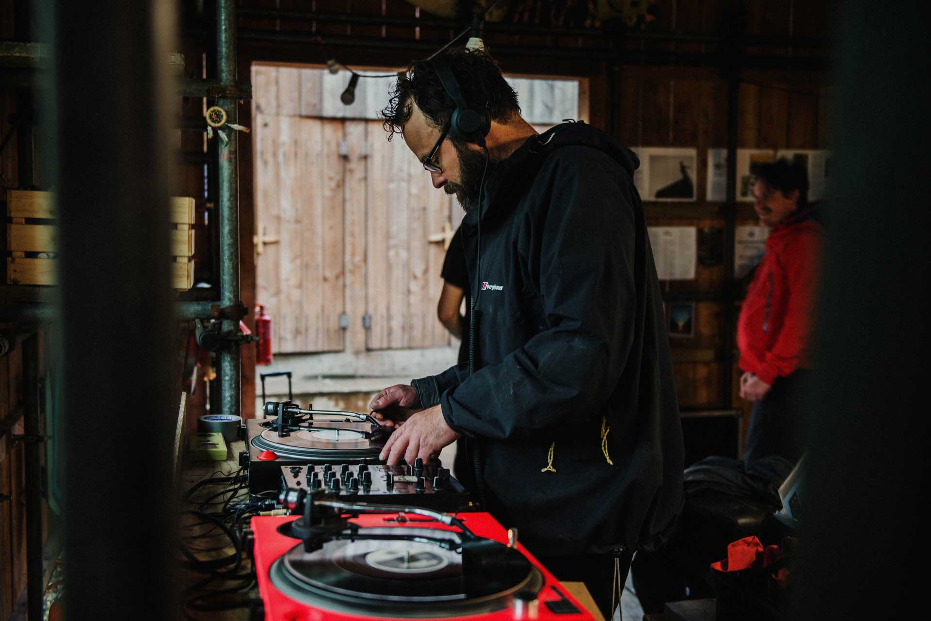 a DJ playing vinyl records at Kudhva