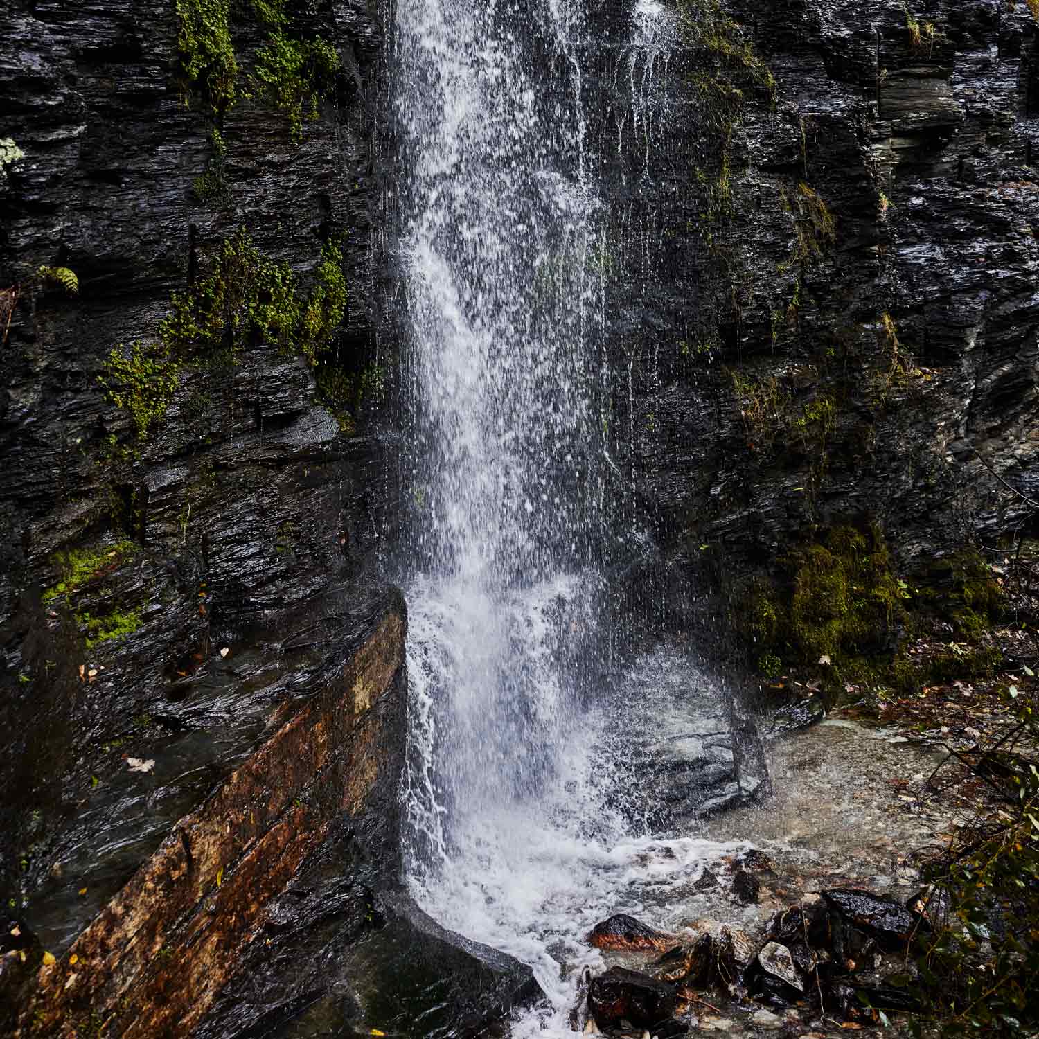 a dramatic waterfall on Kudhva's site, Tintagel, Cornwall